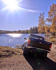 Bakfra - Innsjø og sol i forgrunn.jpg Bakfra - Innsjø og sol i forgrunn.jpg