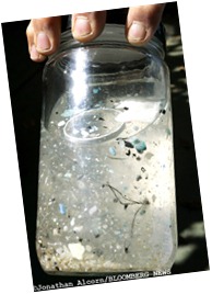 April 02, 2008 Long Beach, California   Marine researcher Charles Moore holds an ocean water sample with debris from the 