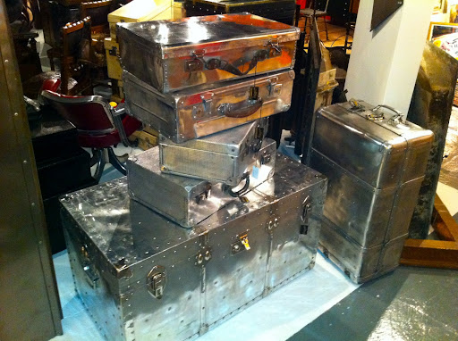 These metal trunks are so unusual. They would look great in a modern-looking room, with their sleek exteriors.
