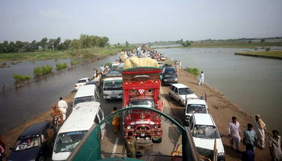 People flee flooded areas in Tando Muhammad Khan, Sindh province, Pakistan, 18 September 2011. The number of people affected in recent floods in Pakistan rose above seven million, as authorities scrambled to provide relief goods and evacuate marooned people, the government said on Saturday. The floods, brought by heavy monsoon downpours which started at the end of August, have inundated vast areas of the southern province of Sindh. EPA / REHAN KHAN