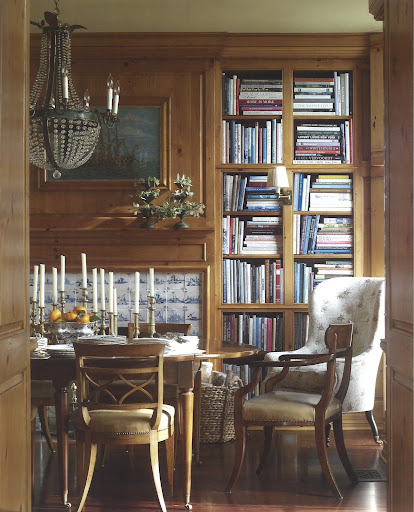 From the Belling House in Newport Bay, California, this dining room also serves as a library. The mix of pine paneling and the rustic French chandelier brings to the space both From the Belling House in Newport Bay, California, this dining room also serves as a library. The mix of pine paneling and the rustic French chandelier brings to the space both