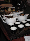 The four teas Cynthia brought were steeping in various degrees of hot water.