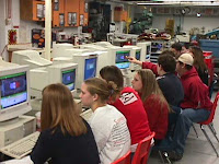 Students trying out the strategy simulator