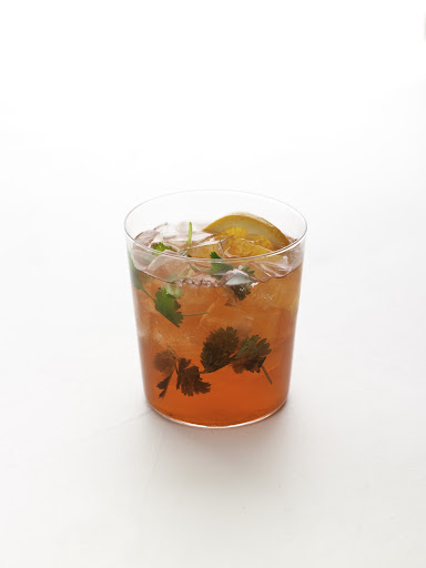 Cilantro Negroni—cilantro sprigs, Campari, club soda, and an orange wedge. Cilantro Negroni—cilantro sprigs, Campari, club soda, and an orange wedge.