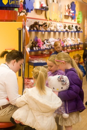 12 31 12_build a bear girls by stuffing machine