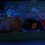 Breakfast - muffin, orange juice, and yogurt