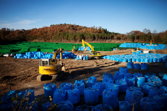 Cleanup in Kawauchi, a village in Fukushima Prefecture. In Okuma, decontamination efforts have been slow to reduce radiation dosages, and hopes of returning to their ancestral lands have faded for evacuated residents. Ko Sasaki for The New York Times