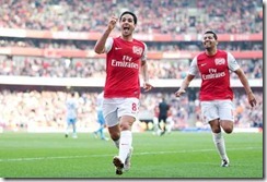 Arsenal's Mikel Arteta celebrates his goal against Aston Villa during an English Premier League soccer match, at the Emirates Stadium in London, Saturday, March 24, 2012. Arsenal won the match 3-0. (AP Photo/Lefteris Pitarakis)