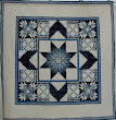 This quilt was pieced by Paula Doyle of Green Mountain Quilts and quilted by Isabel Hall of Compton Quilting Services.The quilting is all freehand and the quilt won first prize for longarm quilting in the Great Northern Quilt Show in 2005.