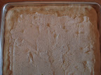 6.	Dough rolled out with ricotta mixture spread on top