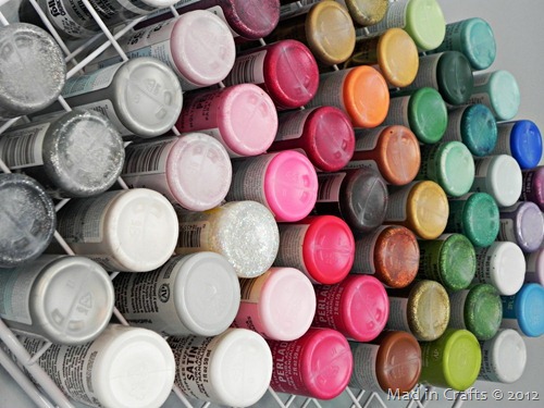 close up of craft paint stored in storage racks