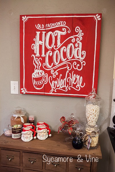 Old Fashioned Hot cocoa served here Sign above a cocoa hot chocolate bar. A truly stunning Christmas Home Tour as part of the Christmas in the Country Blog Tour. This Plaid Inspired Country Christmas will knock your socks off. Features tours of the Living room, Dining Room and a Cocoa hot chocolate bar in the Breakfast room. There is so much inspiration for Christmas decorations in this one post. Be prepared to feel like you are cuddled up by the fire in a warm Northwoods comfy cottage! #country #Christmas #Plaid #Holiday decorating #Holiday ideas #Holidays #Christmas decor #Holiday decor Old Fashioned Hot cocoa served here Sign above a cocoa hot chocolate bar. A truly stunning Christmas Home Tour as part of the Christmas in the Country Blog Tour. This Plaid Inspired Country Christmas will knock your socks off. Features tours of the Living room, Dining Room and a Cocoa hot chocolate bar in the Breakfast room. There is so much inspiration for Christmas decorations in this one post. Be prepared to feel like you are cuddled up by the fire in a warm Northwoods comfy cottage! #country #Christmas #Plaid #Holiday decorating #Holiday ideas #Holidays #Christmas decor #Holiday decor