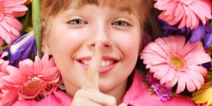 Child giving flower.