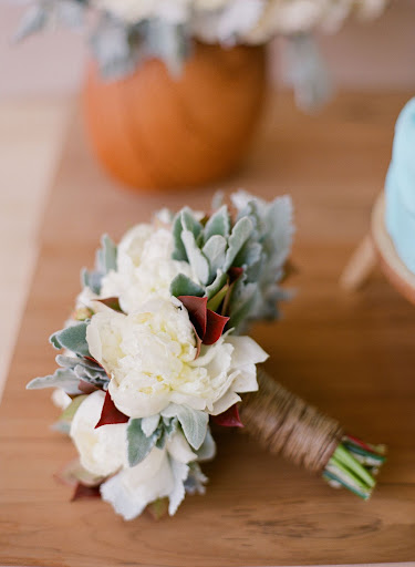Sharla Flock created this bouquet using lambs' ear leaves to add softness. The raffia wrapped stems bring in touches of nude. Sharla Flock created this bouquet using lambs' ear leaves to add softness. The raffia wrapped stems bring in touches of nude.