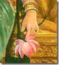 Sita Devi holding flower