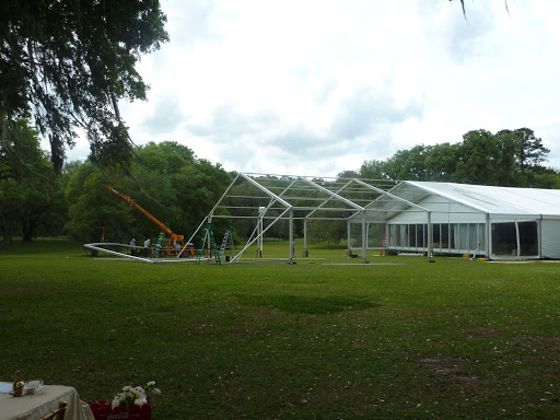 Major wind storms and hurricanes threatened the plans of Katy and Jeff's outdoor ceremony and cocktail hour. So the couple and their planner, Kristin Newman of Kristin Newman Designs, decided to extend the tent as a rain plan.