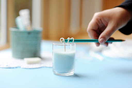 Step 8: Let the wax dry for 3 to 5 hours. Remove the pencil, and cut the wick to the desired length. Step 8: Let the wax dry for 3 to 5 hours. Remove the pencil, and cut the wick to the desired length.