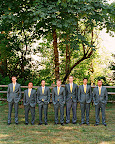 Groom Scott and his groomsmen donned gray suits and sunny yellow ties made to match the design of the couple's invitation suite. Groom Scott and his groomsmen donned gray suits and sunny yellow ties made to match the design of the couple's invitation suite.