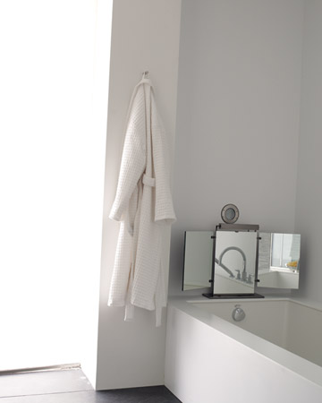 This is my master bathroom, the mirror on the edge of my tub was a gift that I cherish. (marthastewart.com)