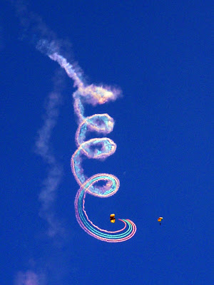 The Golden Knights spiral down with 35' of smoke attached to their legs