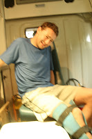 And then came the accident. Simply stretching my leg, I felt a pop in my knee and dropped to the ground in agony. Notice the pained attempt at a smile!