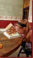 Katie samples her gingerbread House