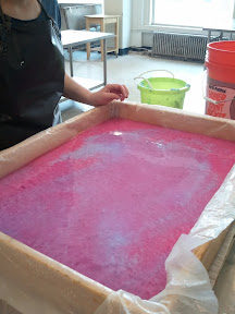 Another example of the pulp swirled together in the deckle box, just waiting for us to pull the plastic out.