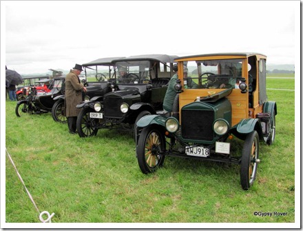 Beautifully restored cars and motorcycle of the early 1900's including a pair of Ford model "T"s