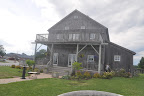 For an outdoor ceremony, the bridal party would exit from this small farmhouse to a clearing in front of the vineyard.