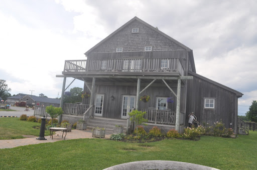 For an outdoor ceremony, the bridal party would exit from this small farmhouse to a clearing in front of the vineyard.