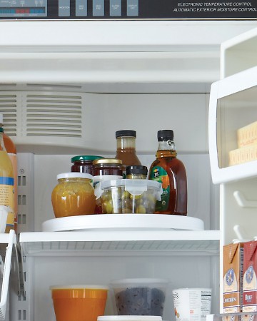Refrigerator door space is prime kitchen real estate. Free it up by moving a few necessities to a turntable, where they’ll still be easy to grab. Refrigerator door space is prime kitchen real estate. Free it up by moving a few necessities to a turntable, where they’ll still be easy to grab.