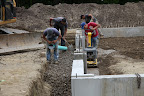 The whole process will take a few weeks.  They've already graded the site and poured the cement footing and foundation.