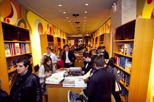 The crowd browses TASCHEN’s book collection and drinks wine while they wait to meet the artist. Photo credit: Jeremiah Wilson The crowd browses TASCHEN’s book collection and drinks wine while they wait to meet the artist. Photo credit: Jeremiah Wilson