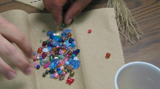Part of the art class involved using beads to create bracelets.