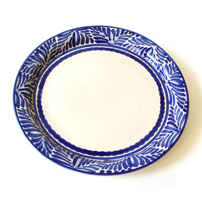 A colorful platter will add a simple and rustic charm to your table. (emiliaceramics.com)