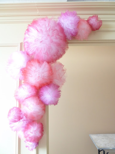 Our tissue poms, mid-installation.