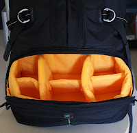 This is the camera compartment. Bright yellow so that you can spot even the smallest accessory. This padded area can also be removed to turn the bag into a normal backpack