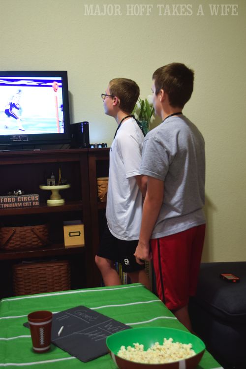 Football video game playing party. Looking for a fun party for your teenage boy? Why not throw a Football video game party? Easy ideas for how to entertain kiddos during the Big Game. Features DiGiorno pizza, personalized football cups, free printable lanyards, and an incredible recipe for football shaped ice cream sandwiches! #GameTimeMVP #CollectiveBias #ad Football video game playing party. Looking for a fun party for your teenage boy? Why not throw a Football video game party? Easy ideas for how to entertain kiddos during the Big Game. Features DiGiorno pizza, personalized football cups, free printable lanyards, and an incredible recipe for football shaped ice cream sandwiches! #GameTimeMVP #CollectiveBias #ad