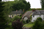 Thatched-roof cottages in Woodford