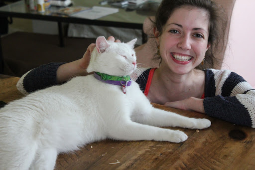 Bing purrs loudly as he poses with doting adoptive mom, Molly.  Molly was adopted via AdoptaPet.com from the Sante D'Or Foundation!