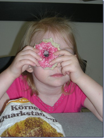 She's got her eye on you. And your doughnut. She's got her eye on you. And your doughnut.