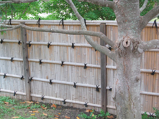 Each side of the walled in Japanese garden uses a different style of traditional Japanese fence. There's this one,