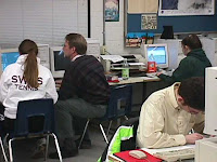 A mentor showing a student how to use our new software
