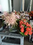 Another cart of flowers, including astilbe and zinnias.