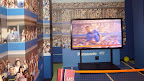 Visitors see themselves live in 3D agaist the backdrop of Arthur Ashe stadium.