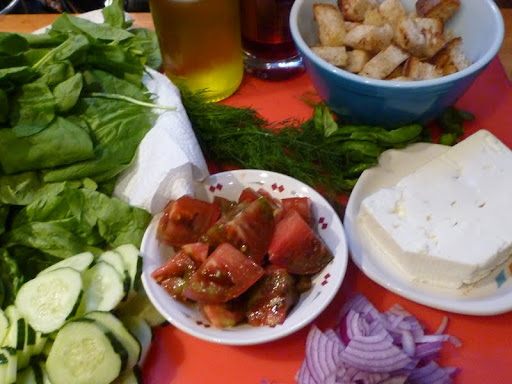 Spinach, cukes, tomatoes, dill, basil, feta, croutons, and red onion.