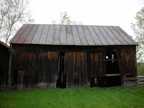 The sills of this eave wall had disintigrated into the ground leaving the posts rotting in the soil