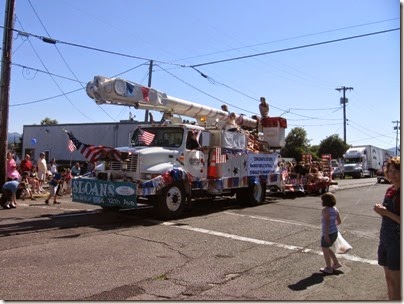 IMG_1715 Columbia River PUD International 4000-Series Line Truck pulling the Rainier Girls Softball 12U Team in the Rainier Days in the Park Parade on July 12, 2008