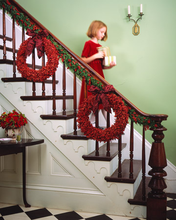 These wreaths made of juniper and pepperberry add a splash of color to this otherwise traditional banister. These wreaths made of juniper and pepperberry add a splash of color to this otherwise traditional banister.