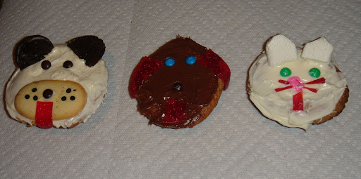 CHILD'S PLAY:  Sonya Fitzpatrick, host of Animal Intuition on Sirius XM Stars,  teamed up with her 7 yr old daughter Emily to create cupcakes of their furry friends. The chocolate dog is a representation of their newly adopted dog Lucky.